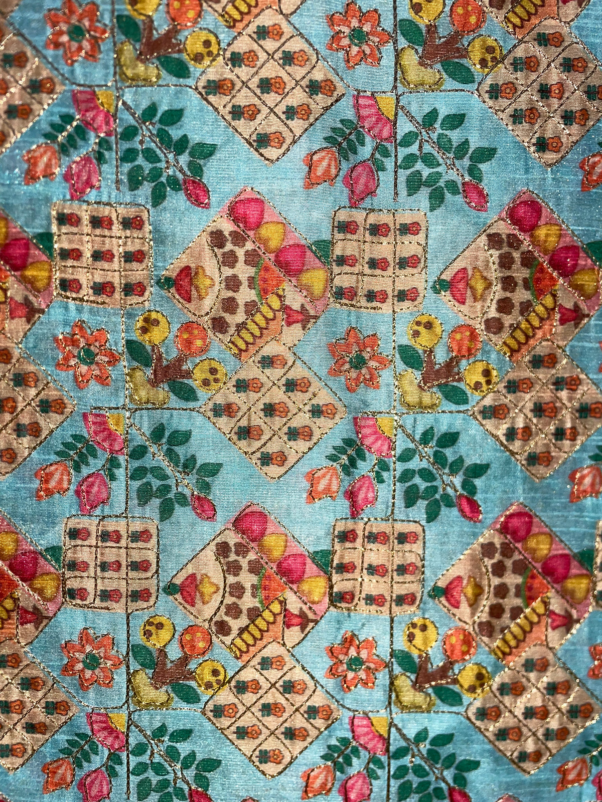 Geborduurde zijdekatoen blauw gebloemd met gouddraad
